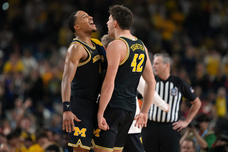 Michigan rolls to national title game with its latest double-digit March win, 91-73 over Arizona